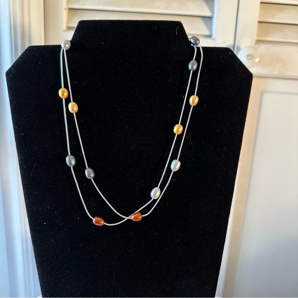 Freshwater multicolored Pearl necklace on thin silver 36” chain.